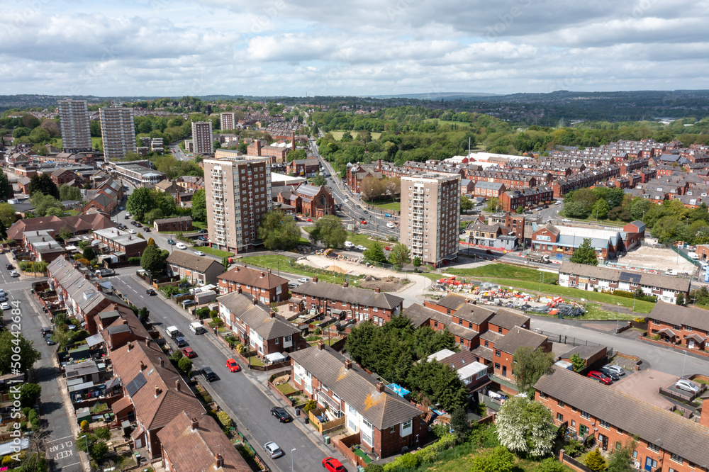 Aerial photo of the town centre of Armley in Leeds West Yorkshire on a bright sunny summers day showing apartment blocks flats and main roads going in to the city centre of Leeds