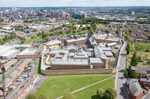 Aerial drone photo of the town of Armley in Leeds West Yorkshire in the UK, showing the famous HM Prison Leeds, or Armley Prison, showing the Jail walls from above on a sunny summers day.