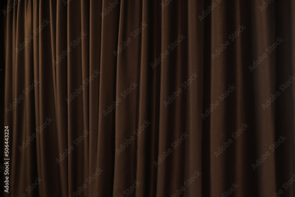 The background photo of dark golden brown color beautiful curtain in the dark luxury design bed room