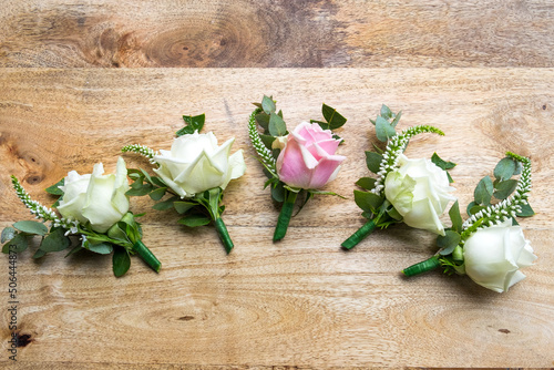 Floral buttonholes for the groom and his groomsmen photo
