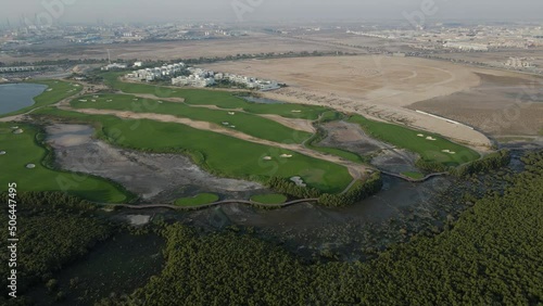 Top view of Ajman Mangroves and Golf course in the United Arab Emirates, 4k Footage photo