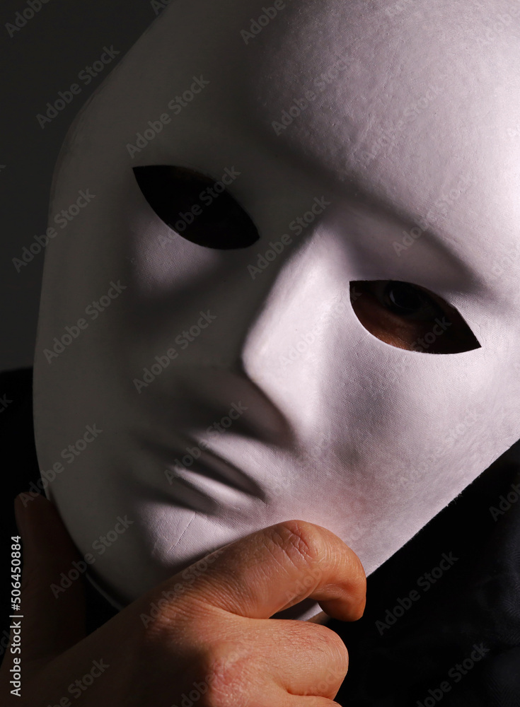 masked man on dark background
masked man on dark background