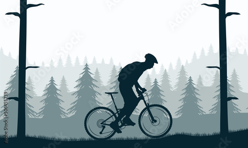 man riding bike in forest