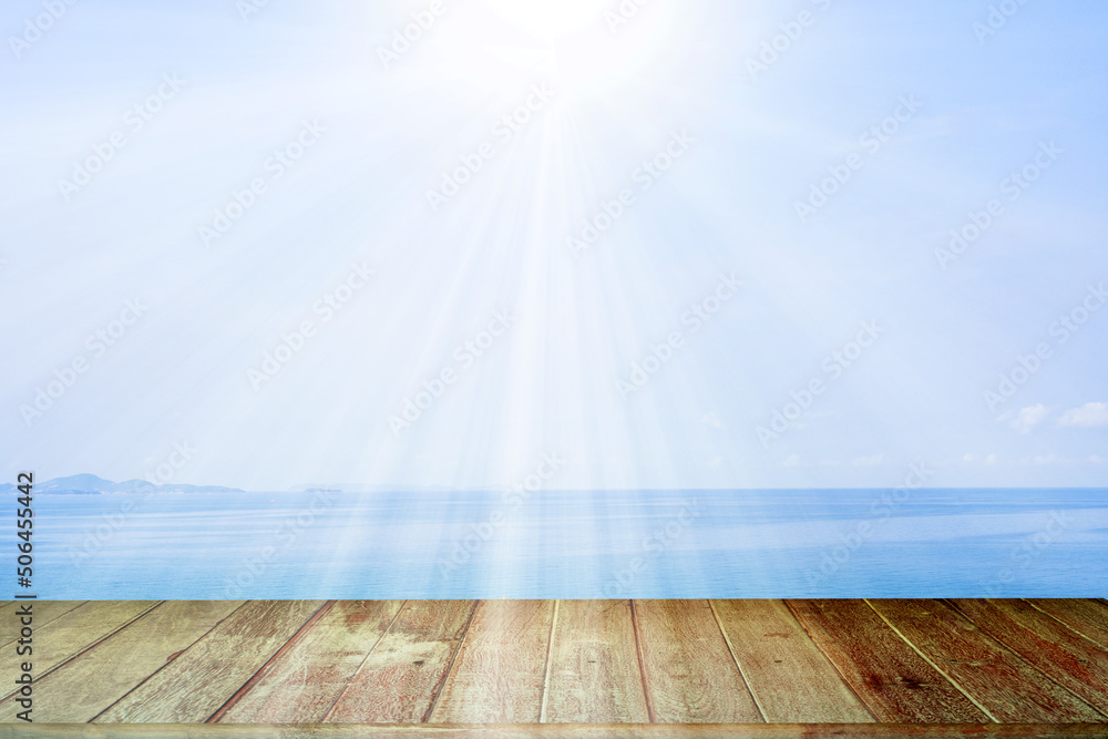 Wood texture Table Against Seascape And Sun rays 