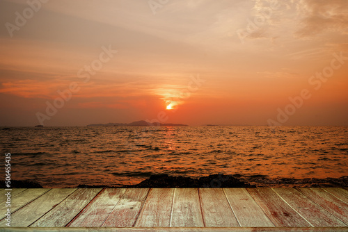 Tabletop Against Seascape at Sunset background. © tienuskin