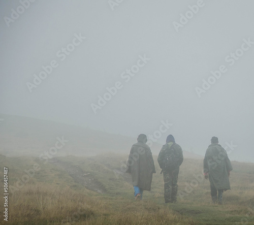 family walking in the fog