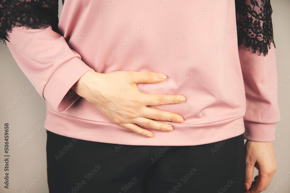 woman hand in ache stomache woman hand in ache stomache
