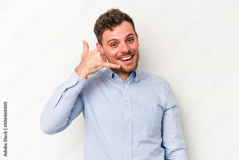 Young caucasian man isolated on white background showing a mobile phone call gesture with fingers. Young caucasian man isolated on white background showing a mobile phone call gesture with fingers.