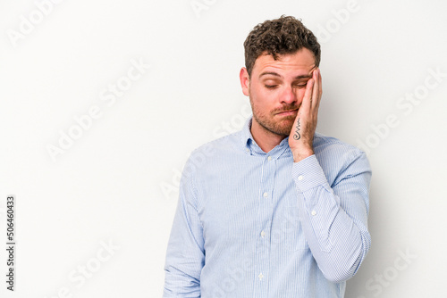Young caucasian man isolated on white background who feels sad and pensive, looking at copy space. © Asier