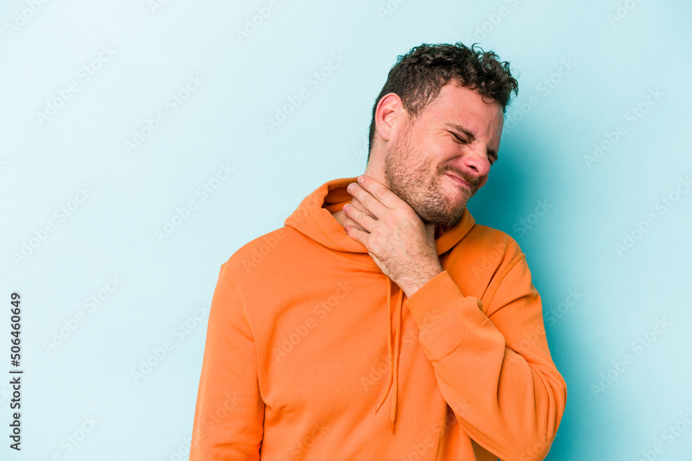 Young caucasian man isolated on blue background suffers pain in throat due a virus or infection. Young caucasian man isolated on blue background suffers pain in throat due a virus or infection.