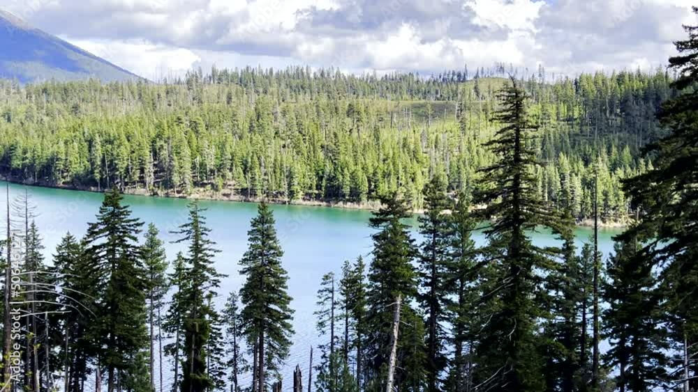 panoramic view of a lake and trees in the mountains panoramic view of a lake and trees in the mountains