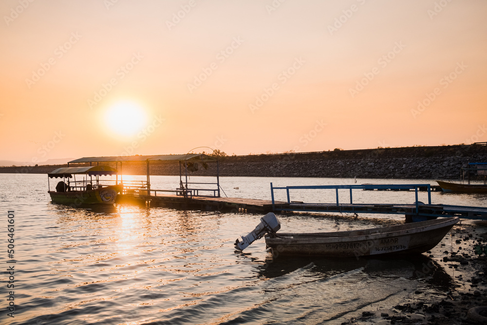 Boats docked at lake at sunset in Mexico