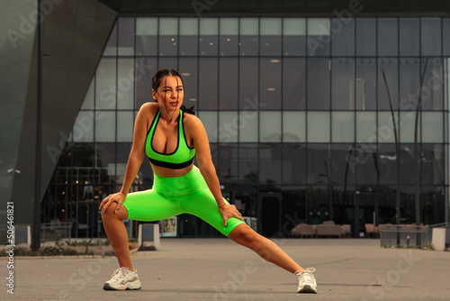 Young woman stretching in the city and prepare for jogging