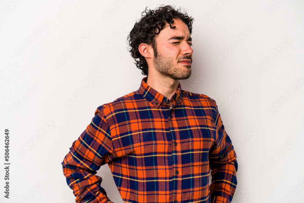 Young caucasian man isolated on white background suffering a back pain. Young caucasian man isolated on white background suffering a back pain.