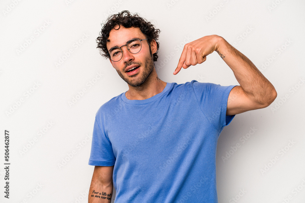 Young caucasian man isolated on white background person pointing by hand to a shirt copy space, proud and confident Young caucasian man isolated on white background person pointing by hand to a shirt copy space, proud and confident