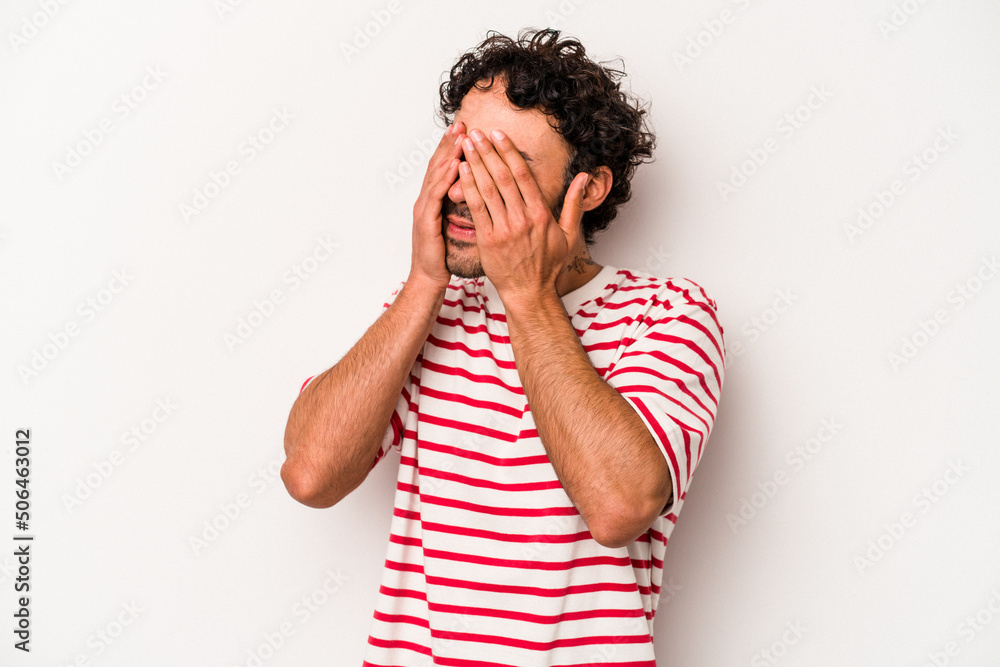 Young caucasian man isolated on white background afraid covering eyes with hands. Young caucasian man isolated on white background afraid covering eyes with hands.