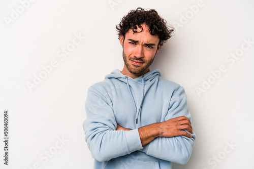 Wallpaper Mural Young caucasian man isolated on white background frowning face in displeasure, keeps arms folded. Torontodigital.ca