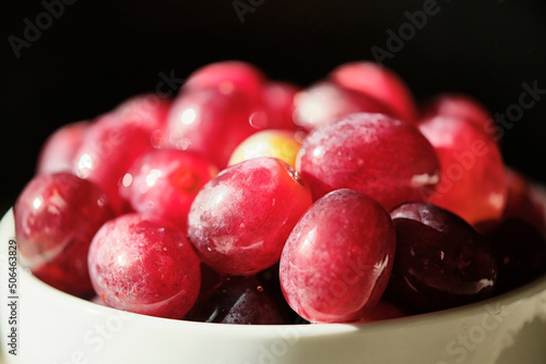 red grapes in a bowl.
