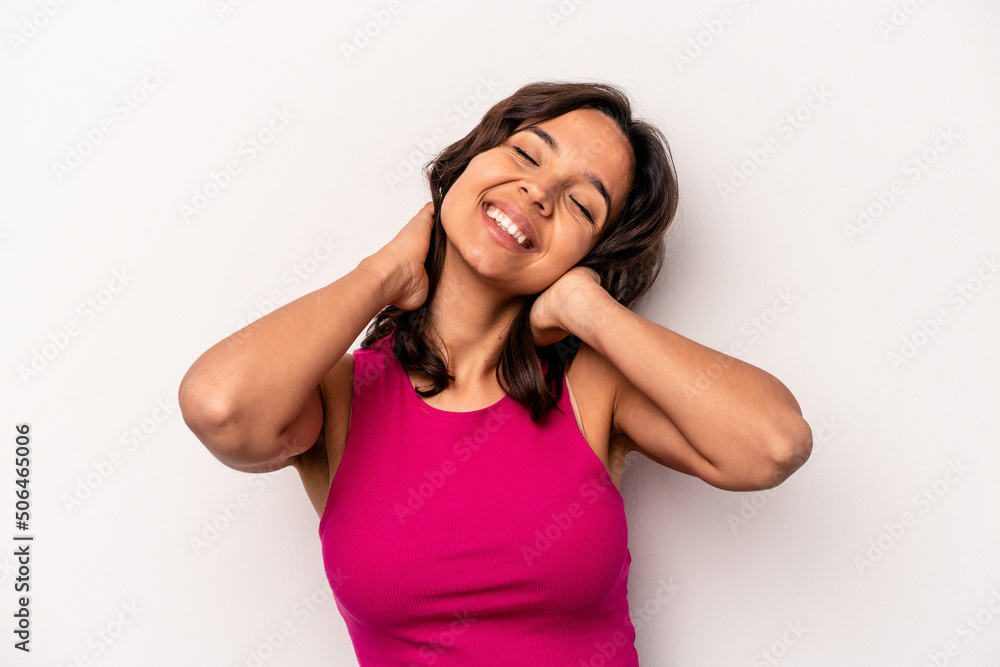 Young hispanic woman isolated on white background stretching arms, relaxed position. Young hispanic woman isolated on white background stretching arms, relaxed position.