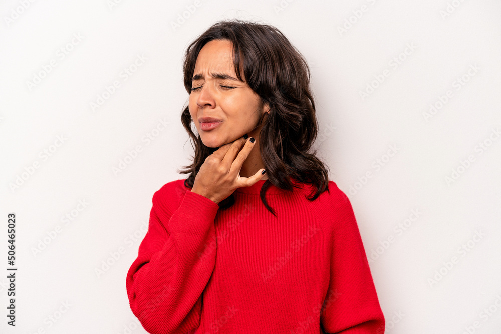 Young hispanic woman isolated on white background suffers pain in throat due a virus or infection. Young hispanic woman isolated on white background suffers pain in throat due a virus or infection.