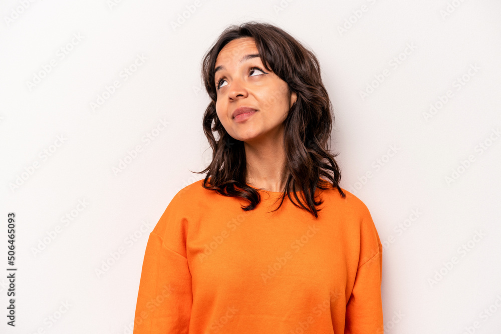 Young hispanic woman isolated on white background relaxed and happy laughing, neck stretched showing teeth. Young hispanic woman isolated on white background relaxed and happy laughing, neck stretched showing teeth.