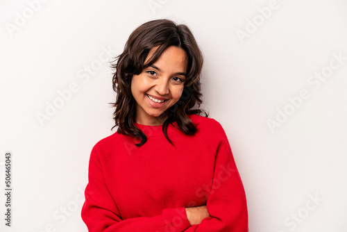 Young hispanic woman isolated on white background laughing and having fun. © Asier