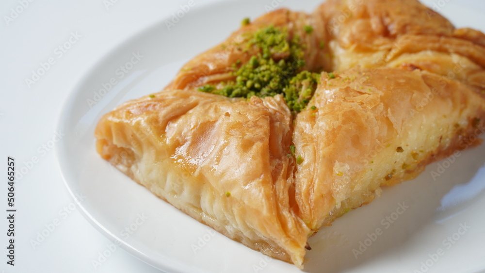 Baklava a layered pastry dessert made of filo pastry, filled with chopped nuts, and sweetened with syrup or honey. Baklava a layered pastry dessert made of filo pastry, filled with chopped nuts, and sweetened with syrup or honey.