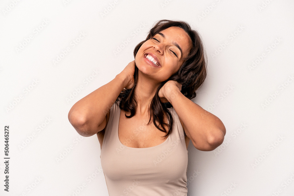 Young hispanic woman isolated on white background feeling confident, with hands behind the head. Young hispanic woman isolated on white background feeling confident, with hands behind the head.