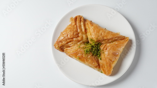 Baklava a layered pastry dessert made of filo pastry, filled with chopped nuts, and sweetened with syrup or honey. photo