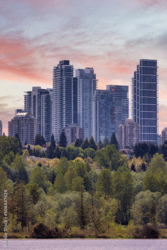 View of Residential Apartment Home Buildings in Metrotown. Green Trees in Deer Lake Park, Burnaby, Vancouver, BC, Canada. Sunset Sky Art Render