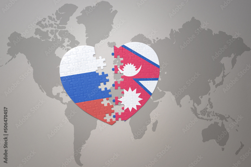 Obraz premium puzzle heart with the national flag of russia and nepal on a world map background. Concept.