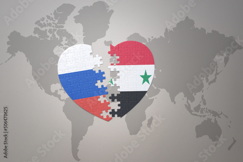 puzzle heart with the national flag of russia and syria on a world map background. Concept.
