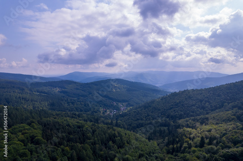 Mountains and forests in the vicinity of Bielsko-Biala. Sunny weather and green trees. The road in the middle of the forest. © Olivier Uchmanski