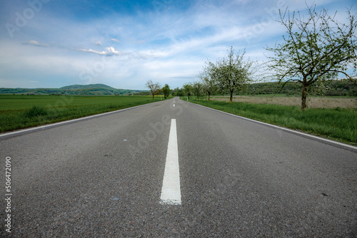 road in the mountains between the fields