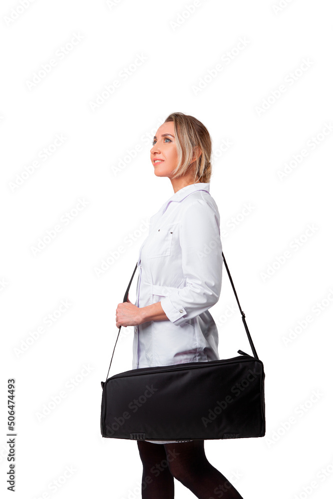 young female doctor in a medical gown holding a black bag and smiling. young female doctor in a medical gown holding a black bag and smiling.