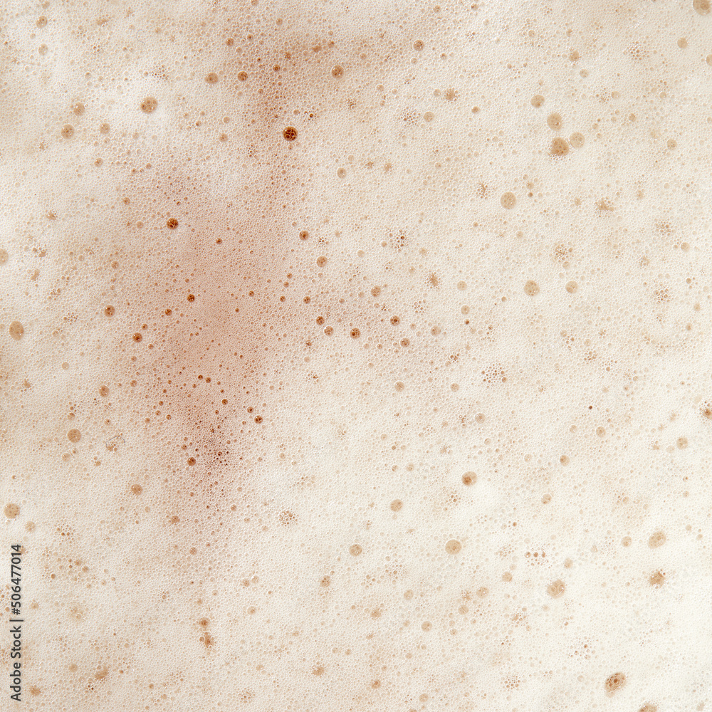 Beer foam top view. Soft fresh Foam on light beer. Bubble froth of beer. Beer foam texture background Beer foam top view. Soft fresh Foam on light beer. Bubble froth of beer. Beer foam texture background