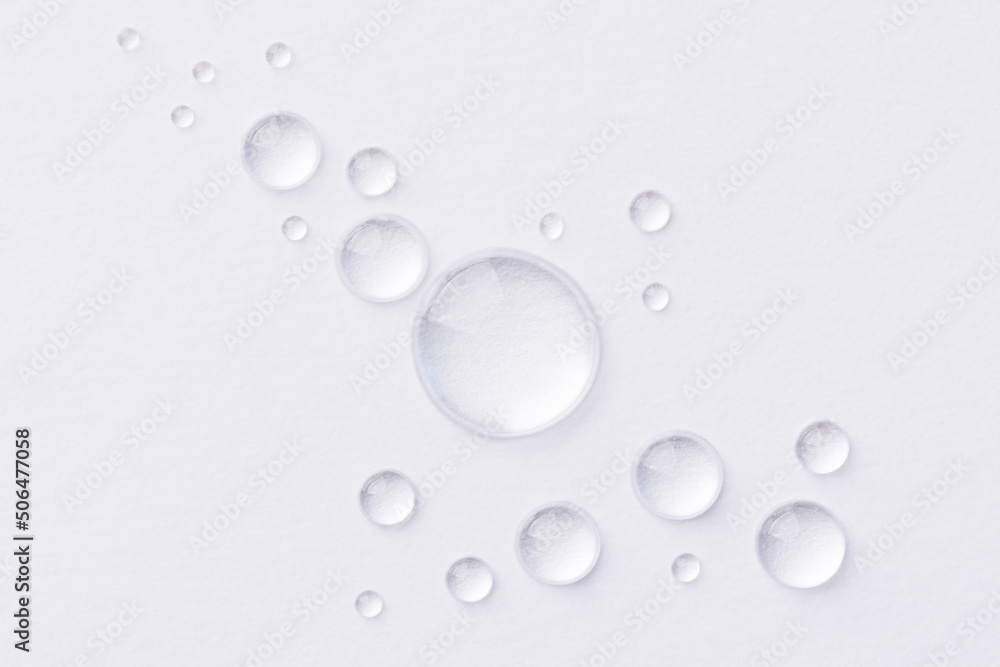 Water drops on white background. Abstract drops of gel. Face serum cosmetics. Water drops on white background. Abstract drops of gel. Face serum cosmetics.