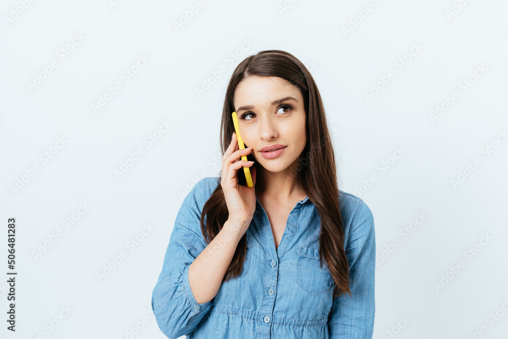 Elegant young brunette woman talking on mobile phone Elegant young brunette woman talking on mobile phone