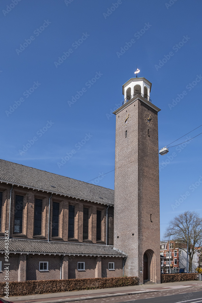 Fototapeta premium View of Kerk De Bron (De Bron Church). Kerk De Bron - three-aisled church with a 35-meter square bell tower. Amsterdam, the Netherlands.