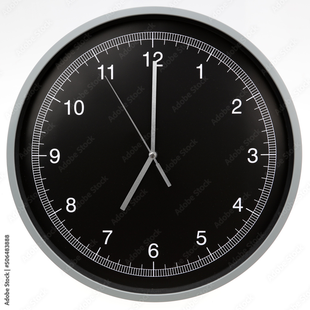 Wall clock showing seven o'clock isolated on white background Wall clock showing seven o'clock isolated on white background