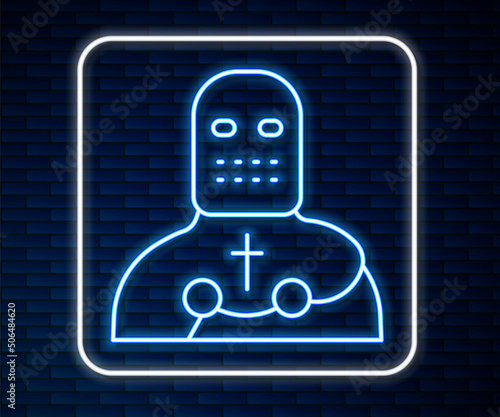 Glowing neon line Knight crusader icon isolated on brick wall background. Vector