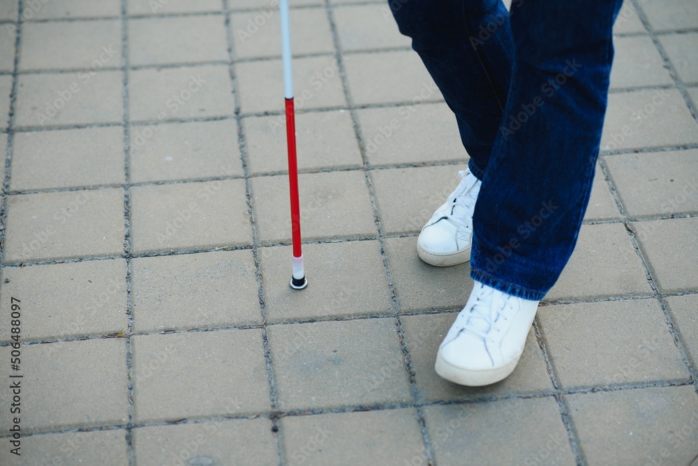 Close-up Of A Blind Man Standing With White Stick On Street Close-up Of A Blind Man Standing With White Stick On Street