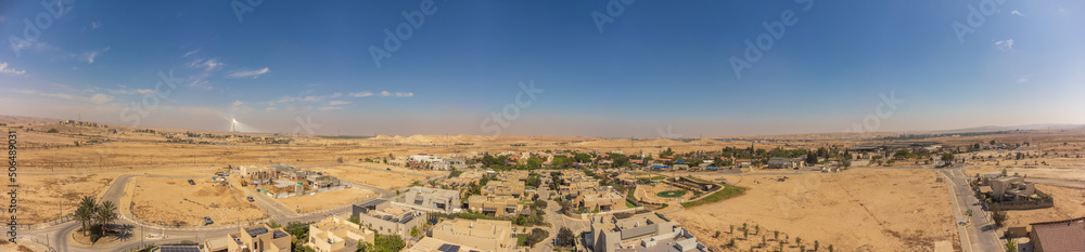 180 dgree panorama from the sky over the roofs Tlalim village of Negev desert