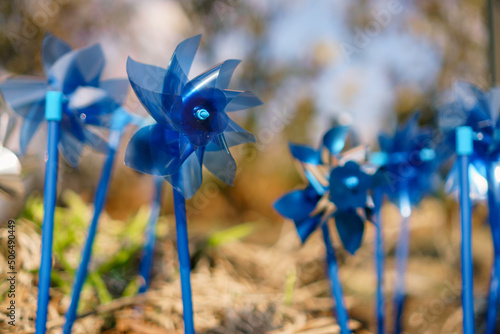 Konstfotografi Close up of bright blue pinwheels which are a symbol commemorating National Child Abuse Prevention Month