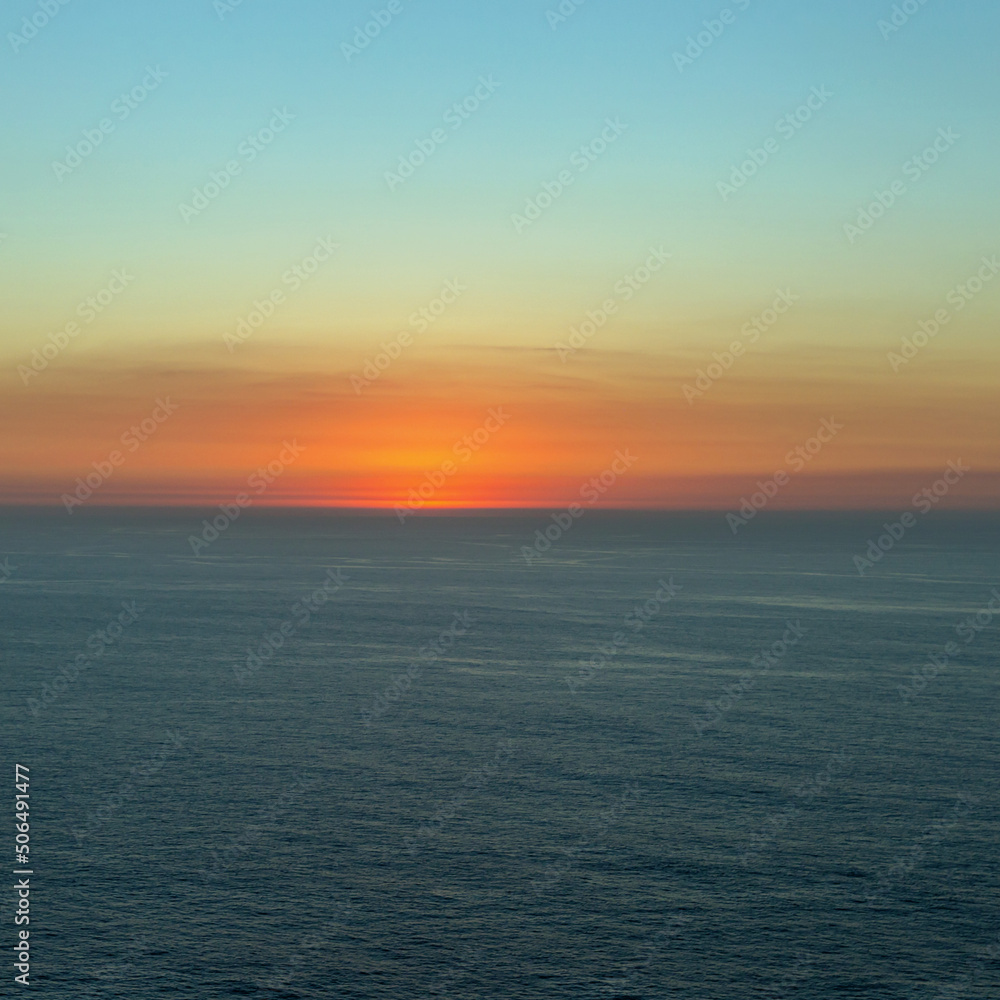 beautiful sunset over the endless expanse of the sea as a natural background