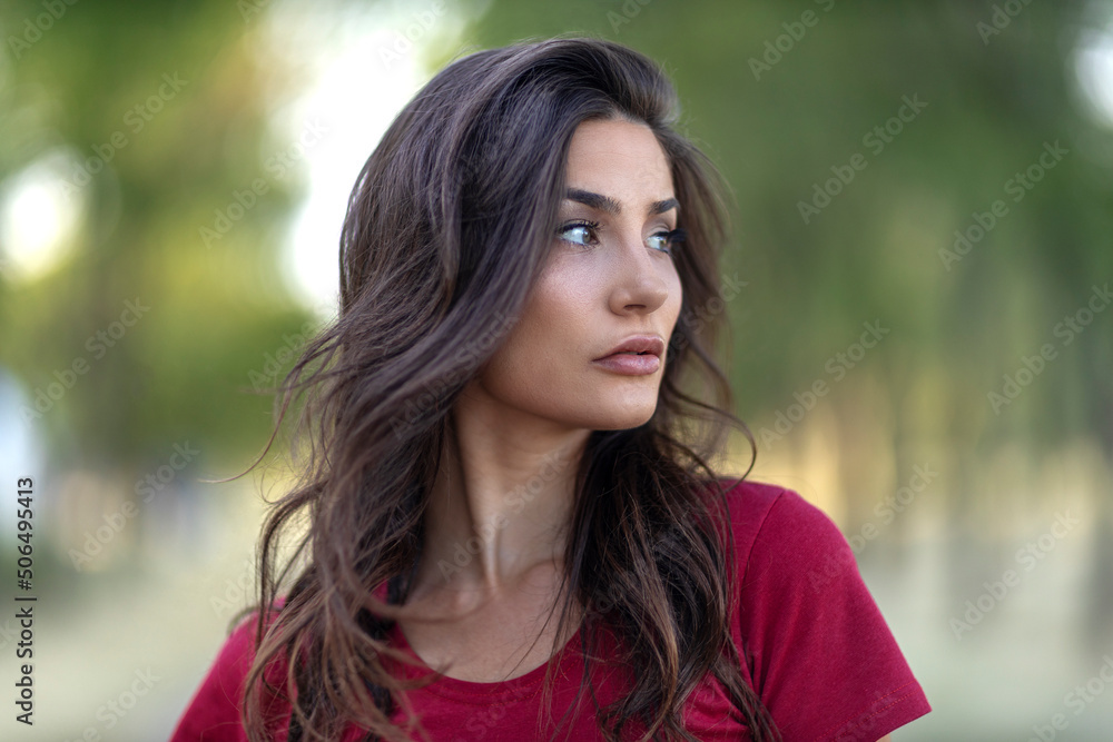 Portrait of beautiful woman in red standing on the road Portrait of beautiful woman in red standing on the road