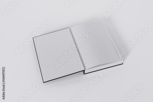 Mockup of a rectangular open on the first-page book with a blank, black glossy cover on white background. Isolated with clipping path.