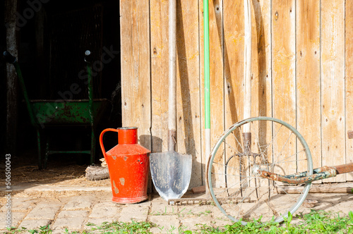 Gardening tools on wooden background.