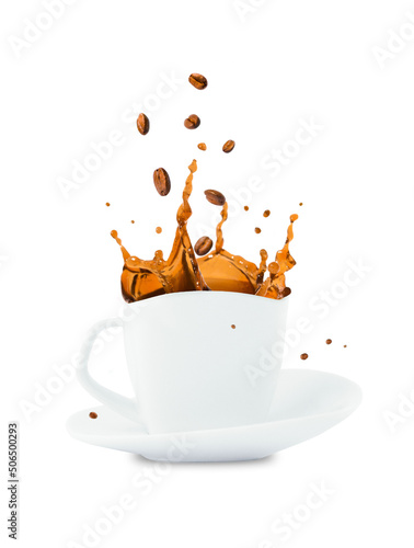 A cup of coffee with a splash and coffee beans.
