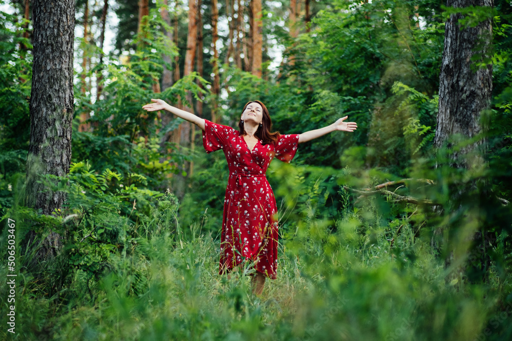 Connecting with nature benefits mental health. Nature Therapy Ecotherapy Helps Mental Health. Nature Impact Wellbeing. Woman in red dress enjoying nature Connecting with nature benefits mental health. Nature Therapy Ecotherapy Helps Mental Health. Nature Impact Wellbeing. Woman in red dress enjoying nature